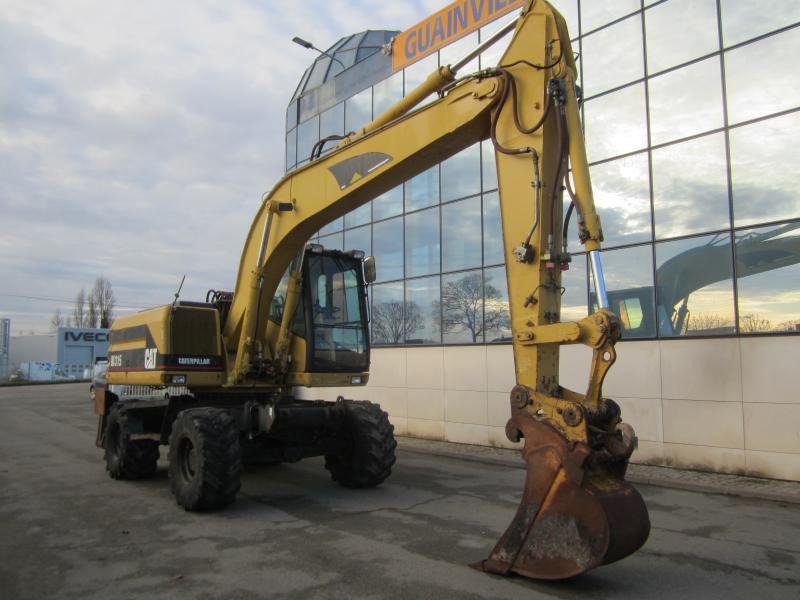 Caterpillar M315 - Bager točkaš: slika 1 Caterpillar M315 - Bager točkaš: slika 1