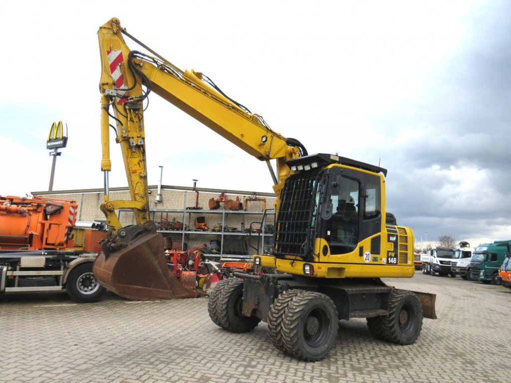 KOMATSU HANOMAG Mobilbagger PW 148 - 8 Bagger 6.824h Deutsch top - Bager točkaš: slika 1 KOMATSU HANOMAG Mobilbagger PW 148 - 8 Bagger 6.824h Deutsch top - Bager točkaš: slika 1