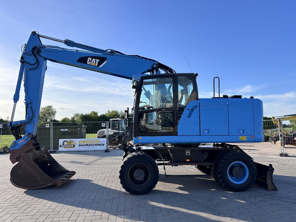 CATERPILLAR M 318 F Oil Quick OQ 65 Deutsche Maschine Top ! - Bager točkaš: slika 1 CATERPILLAR M 318 F Oil Quick OQ 65 Deutsche Maschine Top ! - Bager točkaš: slika 1