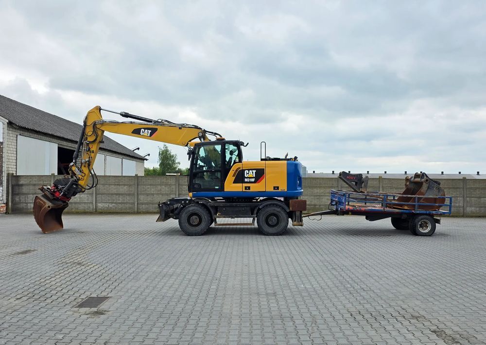 Caterpillar M318F, 2018 ROK, PODPORY + PŁUG, ROTOTILT - Bager točkaš: slika 1 Caterpillar M318F, 2018 ROK, PODPORY + PŁUG, ROTOTILT - Bager točkaš: slika 1