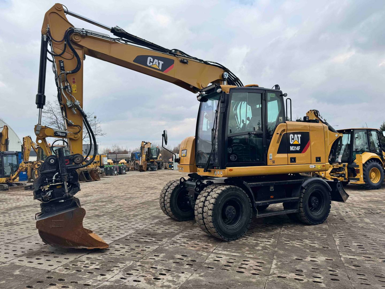 CAT M314F - Bager točkaš: slika 1 CAT M314F - Bager točkaš: slika 1
