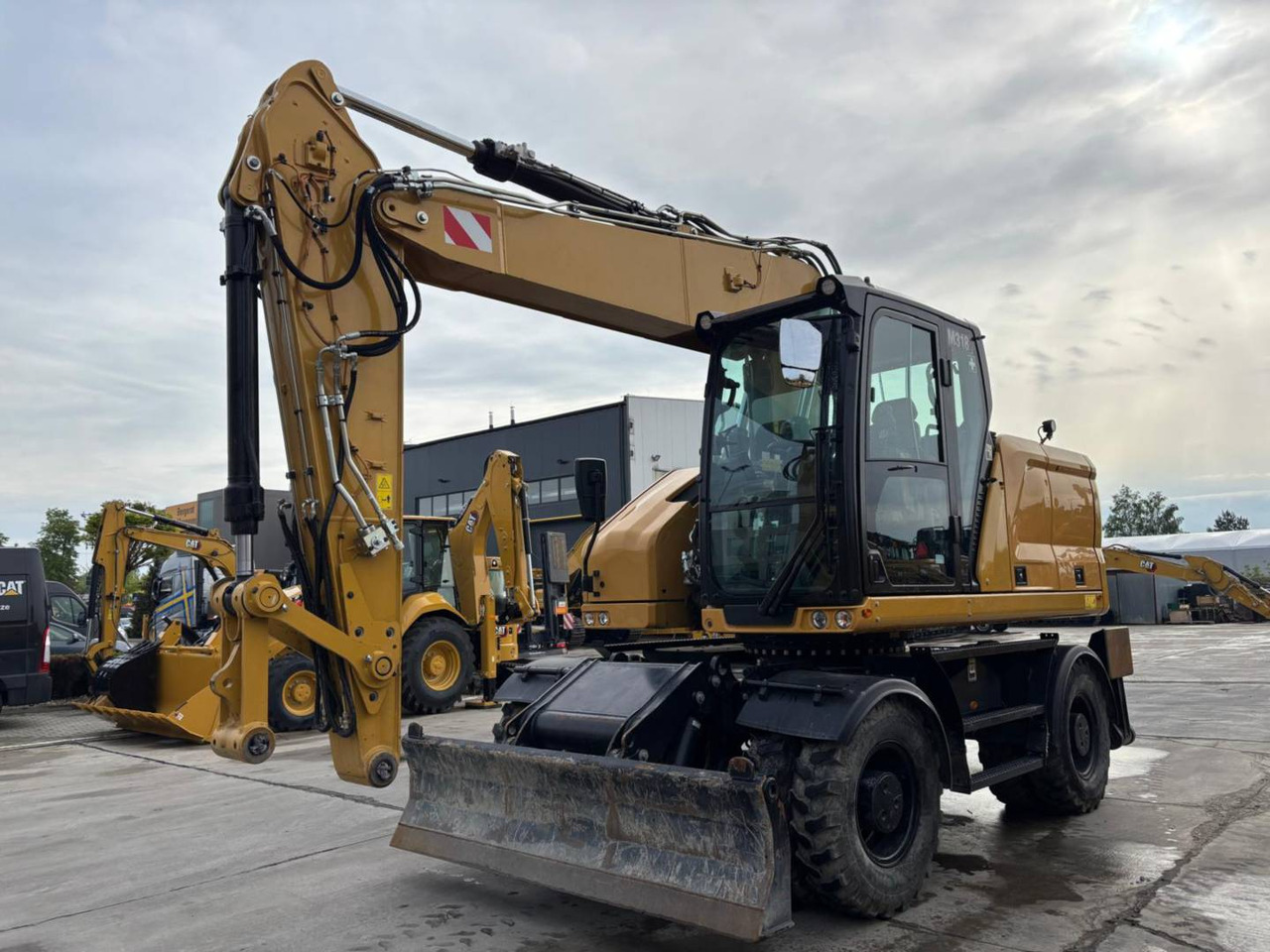 CAT M318 - Bager točkaš: slika 1 CAT M318 - Bager točkaš: slika 1