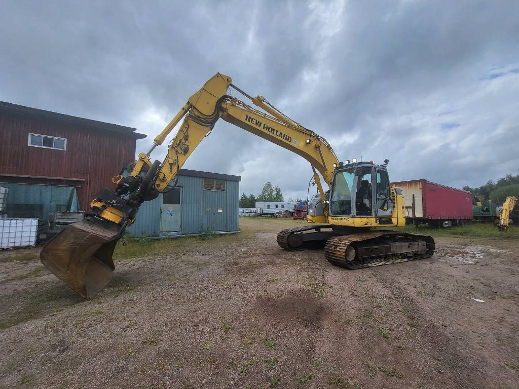 New Holland Kobelco E 235 B SR-2 - Bager guseničar: slika 1 New Holland Kobelco E 235 B SR-2 - Bager guseničar: slika 1