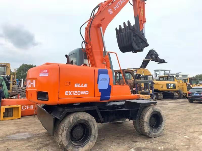 HITACHI EX120WD - Bager točkaš: slika 1 HITACHI EX120WD - Bager točkaš: slika 1