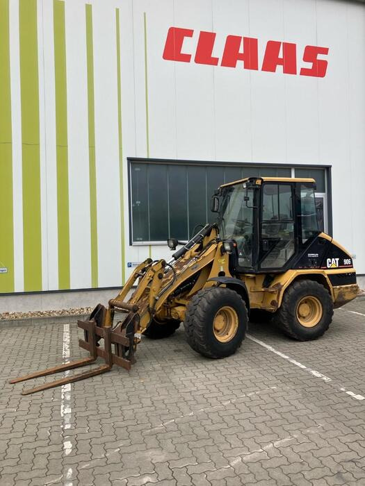 Caterpillar 906 - Utovarivač točkaš: slika 1 Caterpillar 906 - Utovarivač točkaš: slika 1