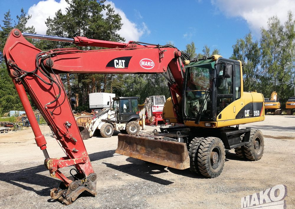 Caterpillar M315 C - Bager točkaš: slika 1 Caterpillar M315 C - Bager točkaš: slika 1