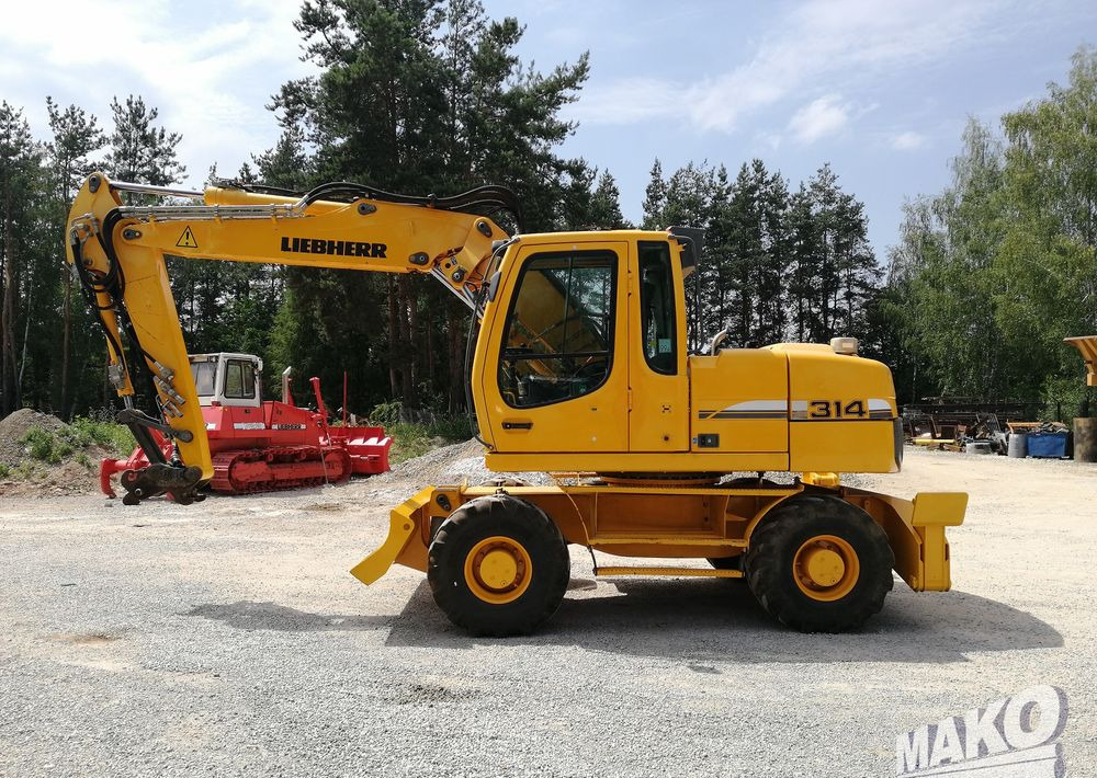 Liebherr A 314 Litronic - Bager točkaš: slika 2 Liebherr A 314 Litronic - Bager točkaš: slika 2