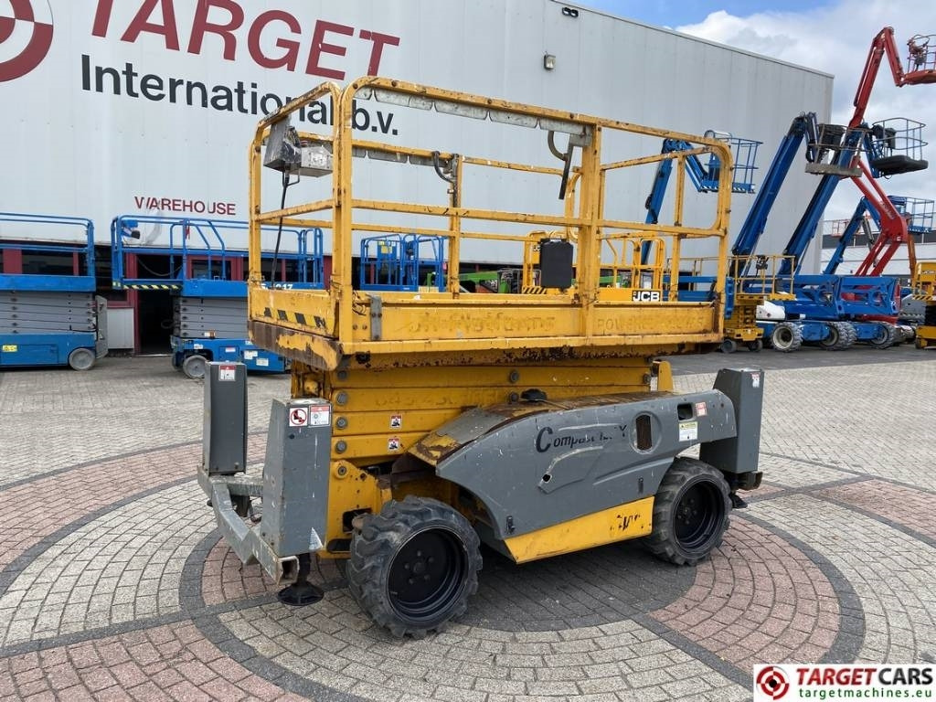 Haulotte Compact 12DX Diesel 4x4 Scissor Work Lift 1206cm - Lift u obliku makaza: slika 1 Haulotte Compact 12DX Diesel 4x4 Scissor Work Lift 1206cm - Lift u obliku makaza: slika 1