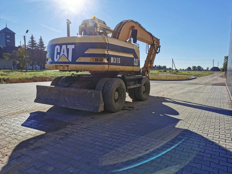 Caterpillar M315 wheel excavator - Bager točkaš: slika 5 Caterpillar M315 wheel excavator - Bager točkaš: slika 5