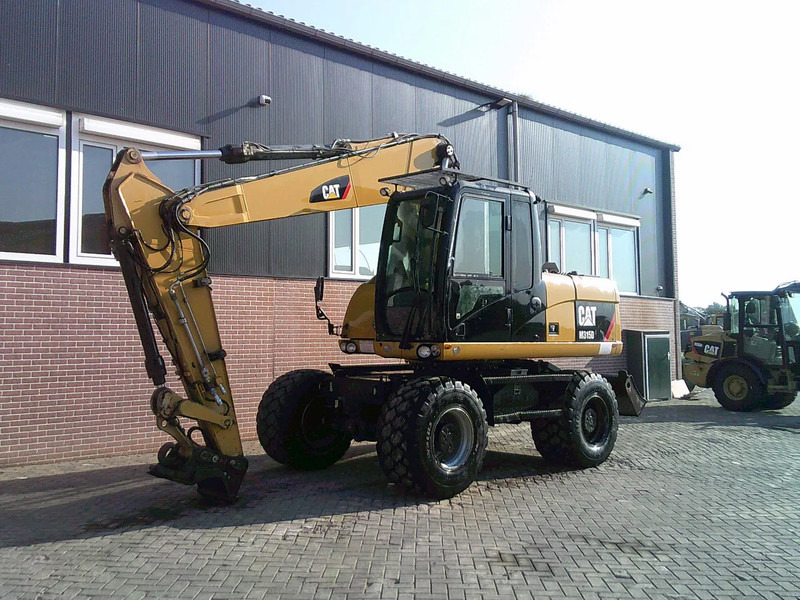 Caterpillar M315D - Bager točkaš: slika 1 Caterpillar M315D - Bager točkaš: slika 1
