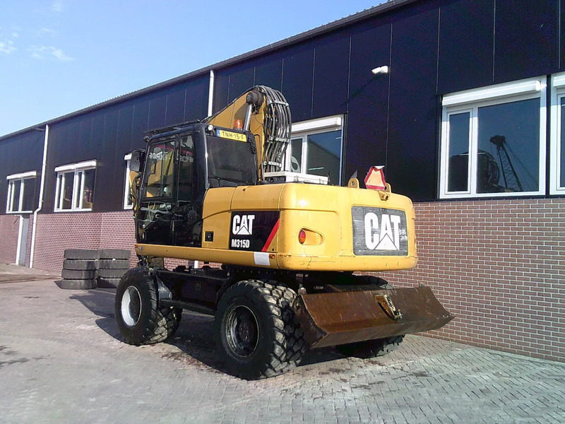 Caterpillar M315D - Bager točkaš: slika 2 Caterpillar M315D - Bager točkaš: slika 2