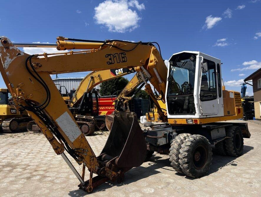Liebherr A316 - Bager točkaš: slika 1 Liebherr A316 - Bager točkaš: slika 1