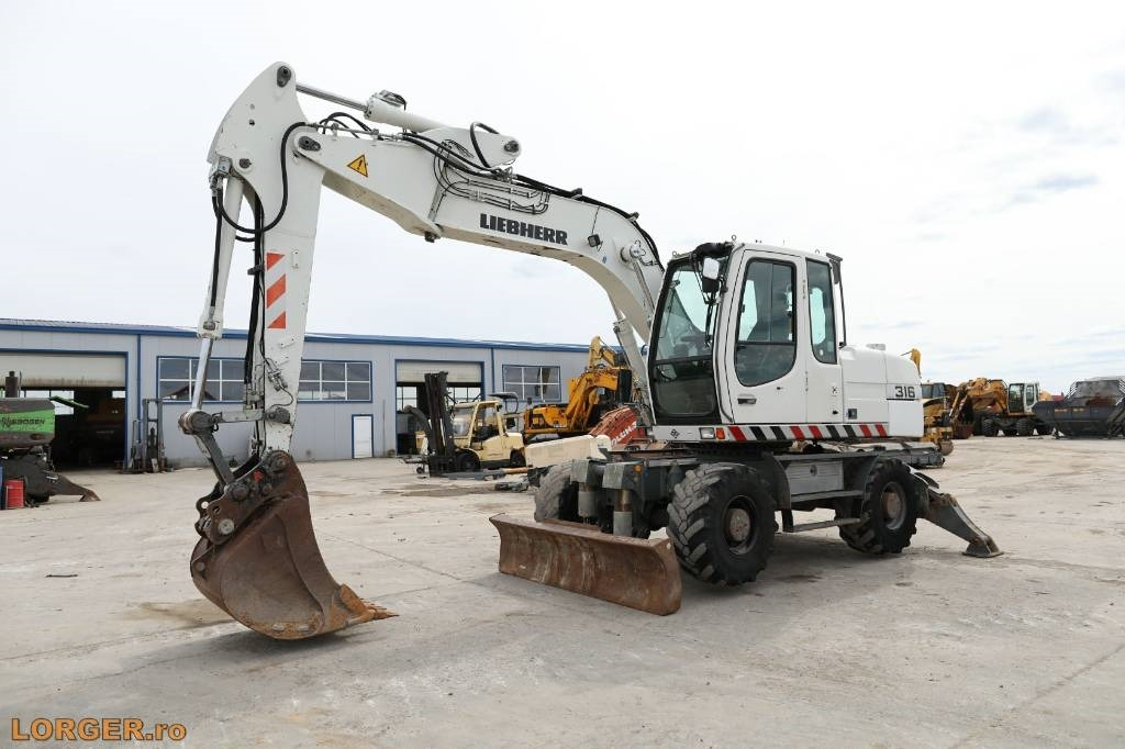 Liebherr A 316 Litronic - Bager točkaš: slika 5 Liebherr A 316 Litronic - Bager točkaš: slika 5