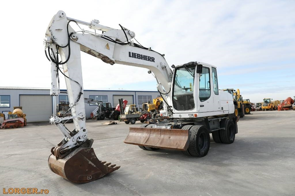Liebherr A 316 Litronic - Bager točkaš: slika 1 Liebherr A 316 Litronic - Bager točkaš: slika 1