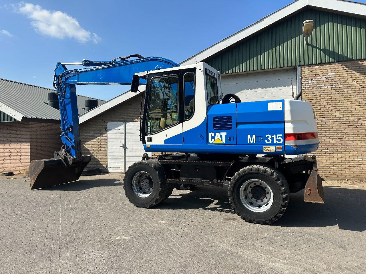 Caterpillar M315 - Bager točkaš: slika 4 Caterpillar M315 - Bager točkaš: slika 4