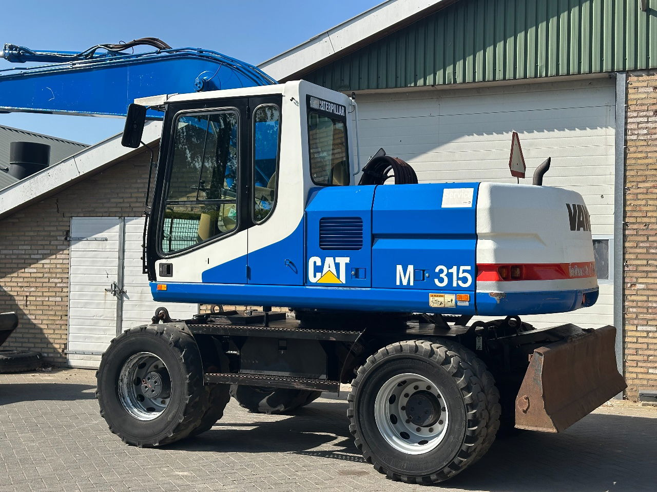 Caterpillar M315 - Bager točkaš: slika 3 Caterpillar M315 - Bager točkaš: slika 3