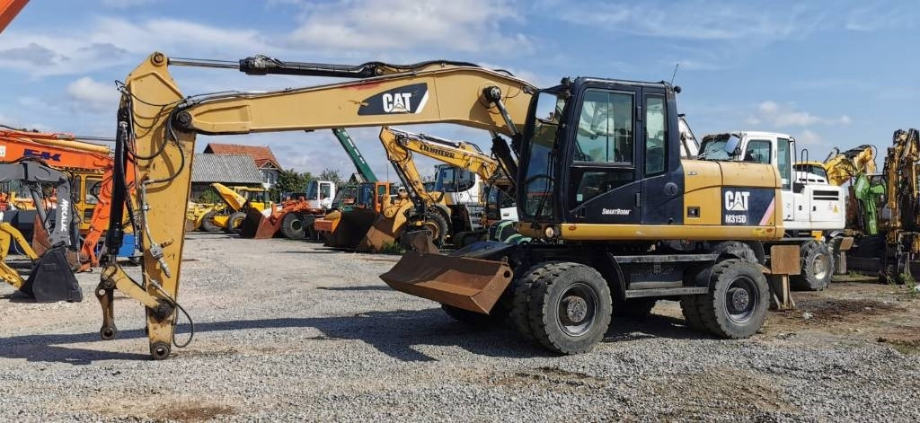 CAT M 315 D - Bager točkaš: slika 1 CAT M 315 D - Bager točkaš: slika 1