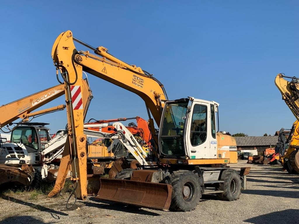 Liebherr A 312 - Bager točkaš: slika 1 Liebherr A 312 - Bager točkaš: slika 1