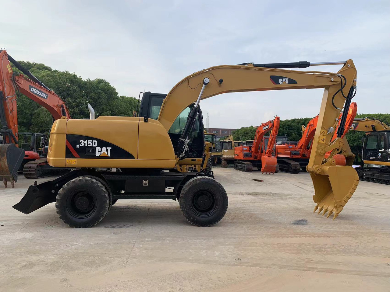 CATERPILLAR 315D - Bager točkaš: slika 1 CATERPILLAR 315D - Bager točkaš: slika 1