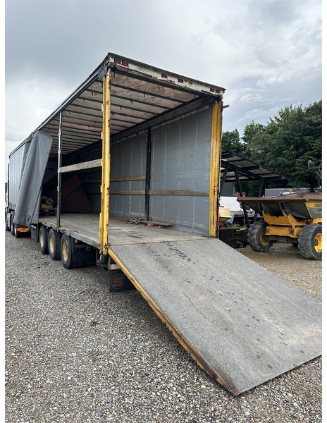Schmitz Cargobull Machine transport trailer with bag ramp - Niska poluprikolica za prevoz: slika 1 Schmitz Cargobull Machine transport trailer with bag ramp - Niska poluprikolica za prevoz: slika 1