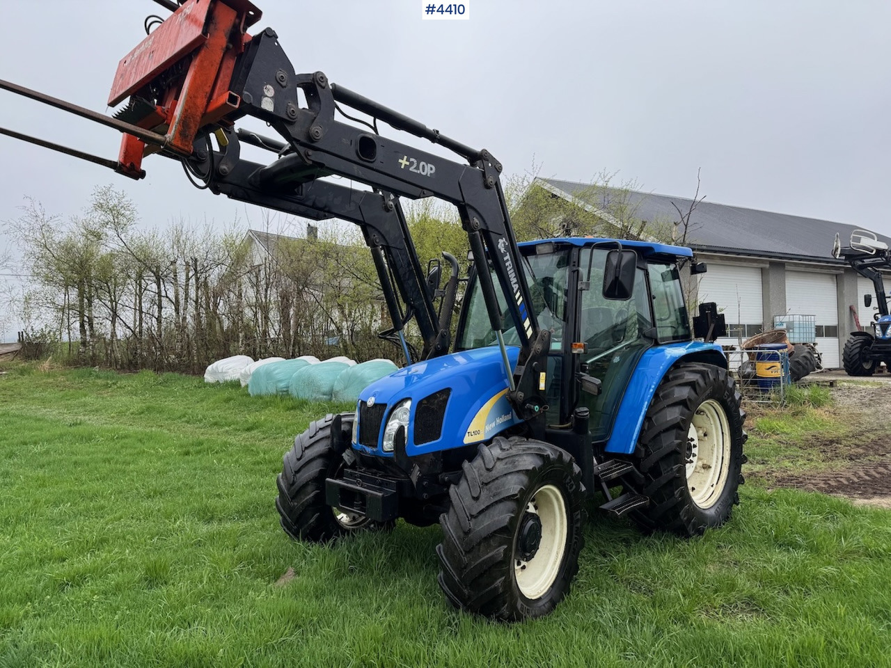 2006 New Holland TL100 A w/Front Loader. - Traktor: slika 1 2006 New Holland TL100 A w/Front Loader. - Traktor: slika 1