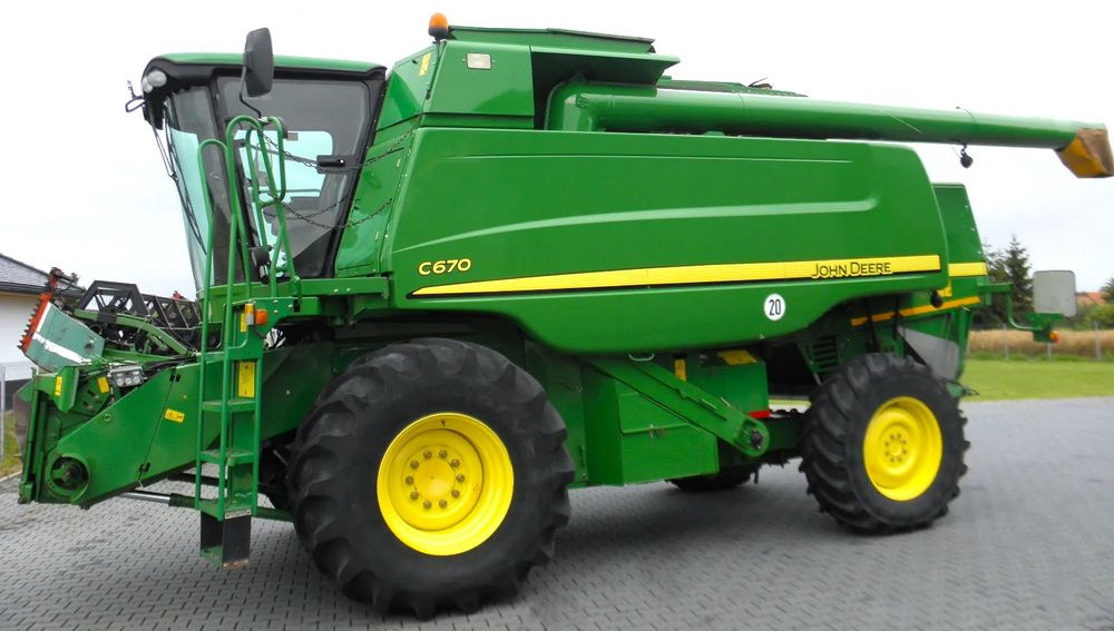 John Deere C 670 2008 Rok, heder 7,6m, 1900 mtg, Nie Malowany, Stan Idealny - Kombinovani kombajn: slika 1 John Deere C 670 2008 Rok, heder 7,6m, 1900 mtg, Nie Malowany, Stan Idealny - Kombinovani kombajn: slika 1
