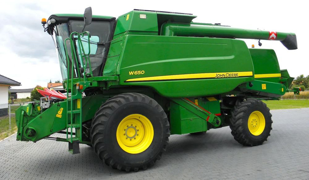 John Deere W650 2008 Rok, heder 6,7m, Nie Malowany, Stan Bardzo Dobry - Kombinovani kombajn: slika 1 John Deere W650 2008 Rok, heder 6,7m, Nie Malowany, Stan Bardzo Dobry - Kombinovani kombajn: slika 1
