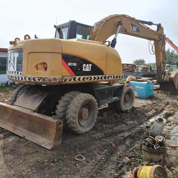 Used Digger Cat 315 Construction Machinery Construction Digger Used Cat 315 Cheap Excavator - Bager točkaš: slika 3 Used Digger Cat 315 Construction Machinery Construction Digger Used Cat 315 Cheap Excavator - Bager točkaš: slika 3