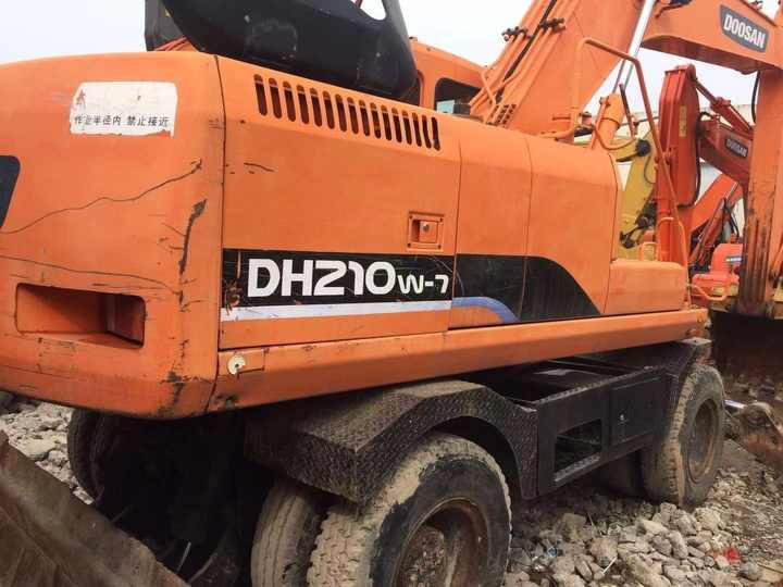 Used Digger Doosan Dh210w-7 Construction Machinery Construction Digger Used Doosan Dh210w-7 Cheap Excavator - Bager točkaš: slika 5 Used Digger Doosan Dh210w-7 Construction Machinery Construction Digger Used Doosan Dh210w-7 Cheap Excavator - Bager točkaš: slika 5