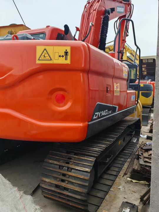 Used Digger DOOSAN DX140 Construction Machinery Construction Digger Used DOOSAN DX140 Cheap Excavator - Bager guseničar: slika 3 Used Digger DOOSAN DX140 Construction Machinery Construction Digger Used DOOSAN DX140 Cheap Excavator - Bager guseničar: slika 3