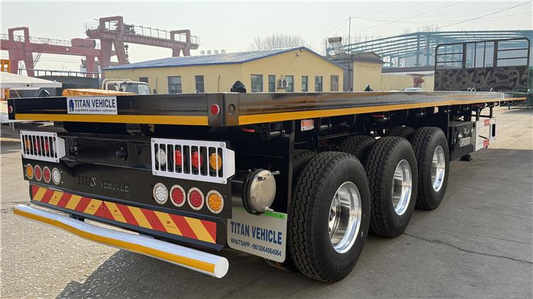 TITAN 12.5M 3 Axle Flat Deck Trailer for Sale In Tanzania - Poluprikolica za prevoz kontejnera/ Poluprikolica sa promenjivim sandukom: slika 3 TITAN 12.5M 3 Axle Flat Deck Trailer for Sale In Tanzania - Poluprikolica za prevoz kontejnera/ Poluprikolica sa promenjivim sandukom: slika 3
