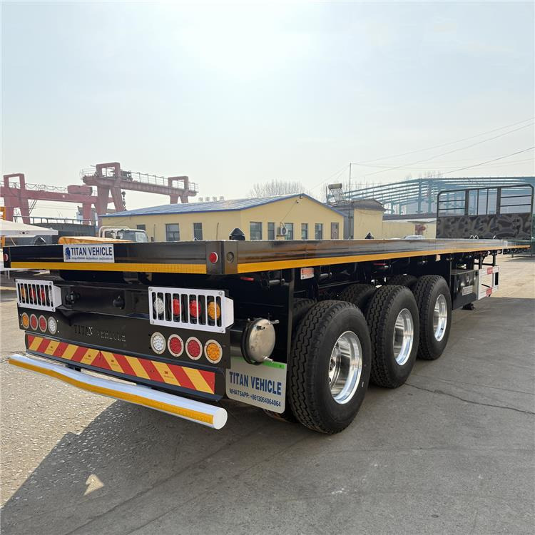 TITAN 12.5M 3 Axle Flat Deck Trailer for Sale In Tanzania - Poluprikolica za prevoz kontejnera/ Poluprikolica sa promenjivim sandukom: slika 1 TITAN 12.5M 3 Axle Flat Deck Trailer for Sale In Tanzania - Poluprikolica za prevoz kontejnera/ Poluprikolica sa promenjivim sandukom: slika 1