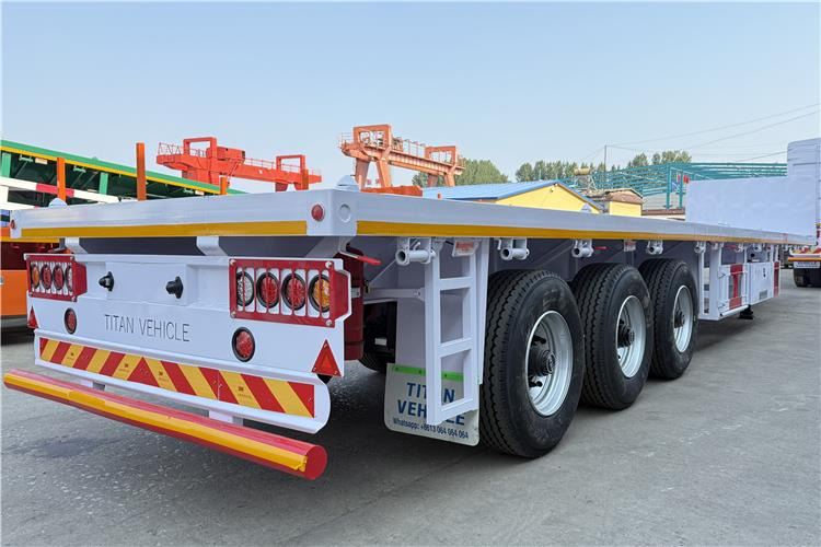 TITAN 3 Axle Flatbed Semi Trailer with Front Wall for Sale In Dominican - Poluprikolica za prevoz kontejnera/ Poluprikolica sa promenjivim sandukom: slika 4 TITAN 3 Axle Flatbed Semi Trailer with Front Wall for Sale In Dominican - Poluprikolica za prevoz kontejnera/ Poluprikolica sa promenjivim sandukom: slika 4