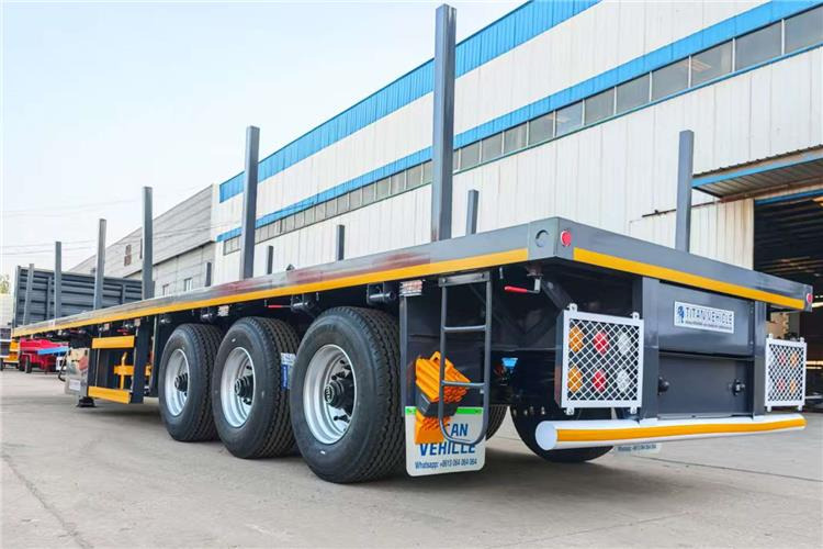TITAN 3 Axle Flatbed Trailer Truck With Wooden Piles Price In Guma - Poluprikolica za prevoz kontejnera/ Poluprikolica sa promenjivim sandukom: slika 5 TITAN 3 Axle Flatbed Trailer Truck With Wooden Piles Price In Guma - Poluprikolica za prevoz kontejnera/ Poluprikolica sa promenjivim sandukom: slika 5