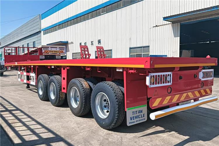 TITAN 4 Axle Shipping Container Flatbed Trailer For Sale In Lagos - Poluprikolica za prevoz kontejnera/ Poluprikolica sa promenjivim sandukom: slika 3 TITAN 4 Axle Shipping Container Flatbed Trailer For Sale In Lagos - Poluprikolica za prevoz kontejnera/ Poluprikolica sa promenjivim sandukom: slika 3