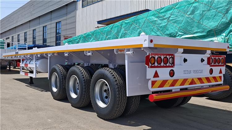 TITAN 40ft Tri Axle Flatbed Semi Trailer for Sale Price In Nigeria Lagos - Poluprikolica za prevoz kontejnera/ Poluprikolica sa promenjivim sandukom: slika 3 TITAN 40ft Tri Axle Flatbed Semi Trailer for Sale Price In Nigeria Lagos - Poluprikolica za prevoz kontejnera/ Poluprikolica sa promenjivim sandukom: slika 3