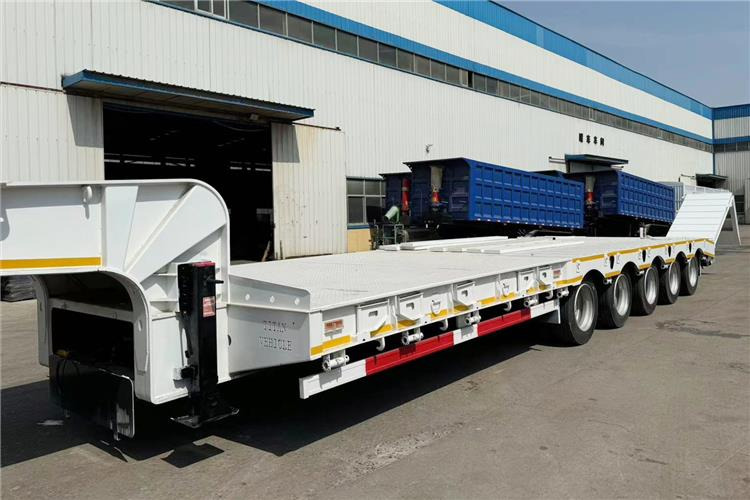 TITAN 5 Axle 100 Ton Low Bed Trailer for Sale In Tanzania - Niska poluprikolica za prevoz: slika 4 TITAN 5 Axle 100 Ton Low Bed Trailer for Sale In Tanzania - Niska poluprikolica za prevoz: slika 4