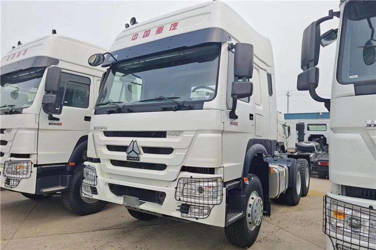 Sinotruk Used Howo Truck 400HP Tractor 6x4 Price for Sale In Tanzania - Tegljač: slika 1 Sinotruk Used Howo Truck 400HP Tractor 6x4 Price for Sale In Tanzania - Tegljač: slika 1