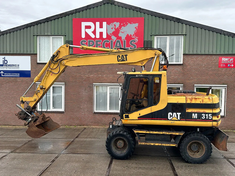 Caterpillar M315 +ROTO CE - Bager točkaš: slika 1 Caterpillar M315 +ROTO CE - Bager točkaš: slika 1