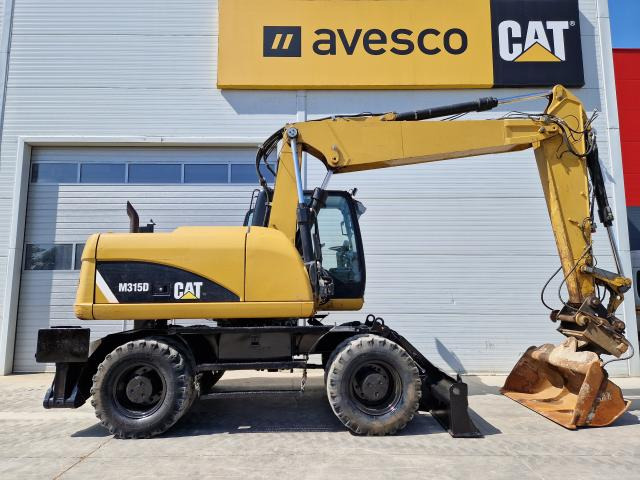 CATERPILLAR M315 - Bager točkaš: slika 4 CATERPILLAR M315 - Bager točkaš: slika 4