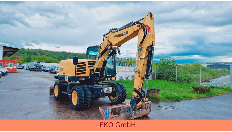 Yanmar B 95W Mit Drei Löffeln und Ein Hammer - Bager točkaš: slika 1 Yanmar B 95W Mit Drei Löffeln und Ein Hammer - Bager točkaš: slika 1