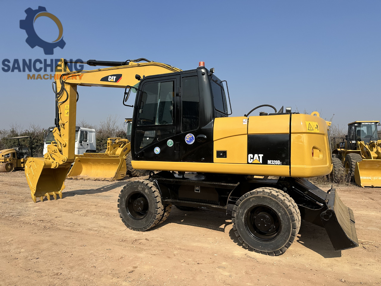 CATERPILLAR M320D2 - Bager točkaš: slika 1 CATERPILLAR M320D2 - Bager točkaš: slika 1
