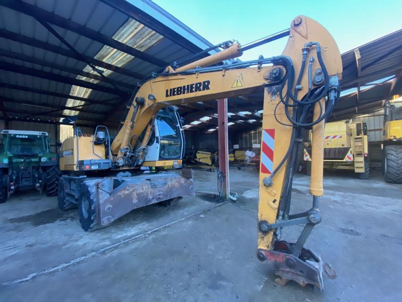 Liebherr A314 Litronic - Bager točkaš: slika 1 Liebherr A314 Litronic - Bager točkaš: slika 1